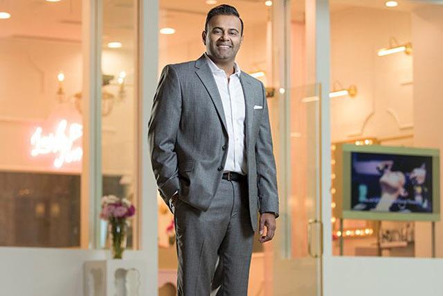 Franchise Consultant in front of small business